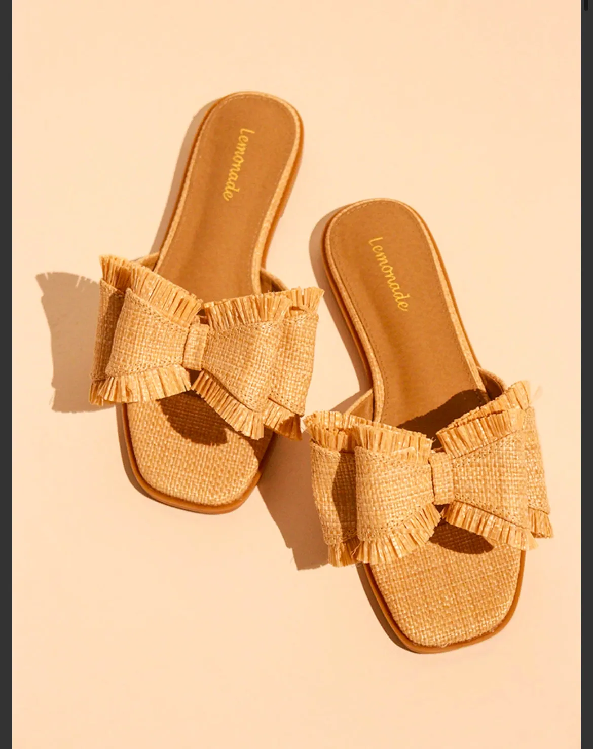 Bow Tie Flat Sandals Available In Natural and Black